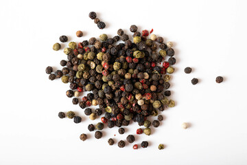 Red, white and black peppercorns. Peppercorns isolated on white. Pepper mix.
