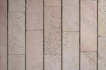 Textured wall lined with shell rock tiles.