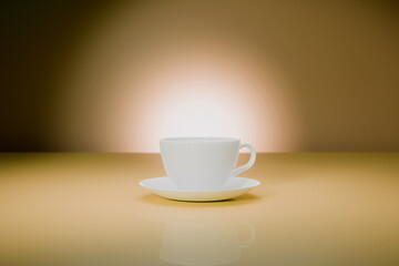 White porcelain cup of gloss floor. Lit brown background
