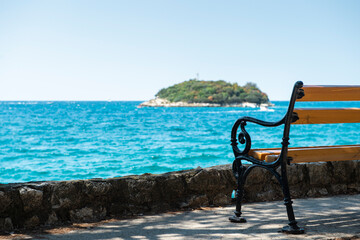 A wooden bench by the sea. A place to relax