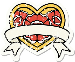distressed sticker tattoo in traditional style of a heart and banner with flowers