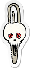 Fototapeta premium retro distressed sticker of a cartoon skull hairclip