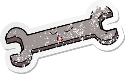 distressed sticker of a cartoon spanner