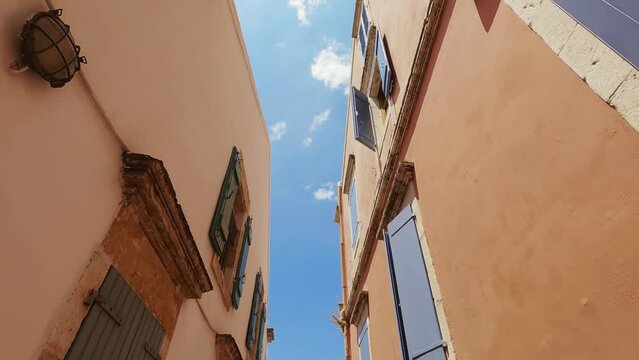 Pov view of architecture in narrow street in Fiskardo, Cephalonia, Greece