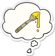 cartoon spoonful of honey with thought bubble as a printed sticker