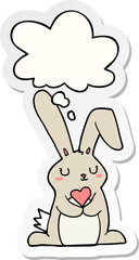 cartoon rabbit in love with thought bubble as a printed sticker