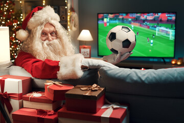 Happy Santa watching a soccer game