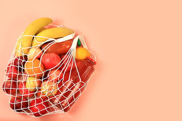 Healthy natural food in eco bag, concept of healthy lifestyle and detox diet, zero waste. Advertising for shop, cafe, restaurant and food delivery, donation. Tropical fruits and juice in tissue p