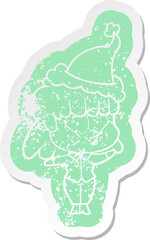 quirky cartoon distressed sticker of a whistling girl wearing santa hat
