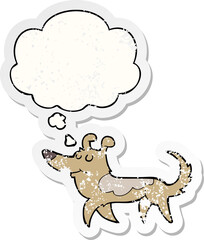 cartoon dog with thought bubble as a distressed worn sticker