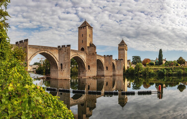 The Valentre bridge is a 14th-century six-span fortified stone arch bridge crossing the river Lot to the west of Cahors, in France