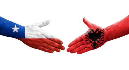 Handshake between Albania and Chile flags painted on hands, isolated transparent image.