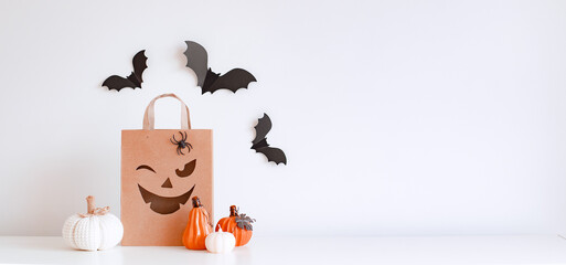 Halloween pumpkins, bats and shopping bag. Happy halloween concept.