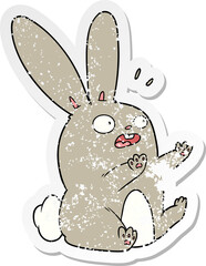 distressed sticker of a cartoon startled rabbit