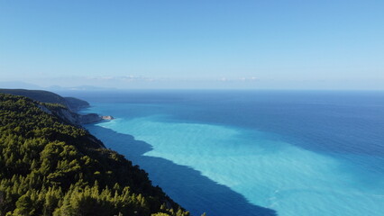 Fototapeta premium The beautiful turquoise blue color of the Ionian Sea that surrounds the Greek island of Lefkada and Potro Katsiki beach
