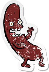 retro distressed sticker of a cartoon sausage