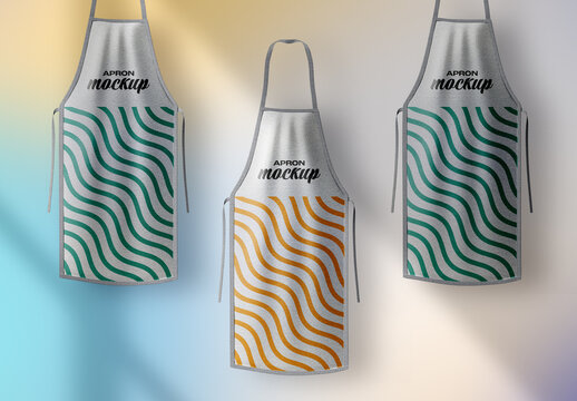 Apron Trio Mockup &ndash; Three Realistic Kitchen Aprons Displayed with Colorful Wavy Patterns for Restaurant Branding and Food Industry Design Projects