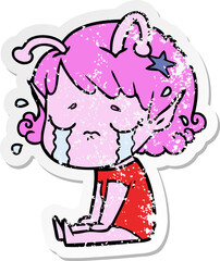 distressed sticker of a cartoon crying alien girl