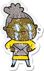 distressed sticker of a cartoon crying woman wearing spectacles