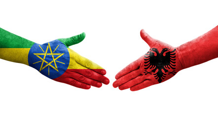 Handshake between Albania and Ethiopia flags painted on hands, isolated transparent image.