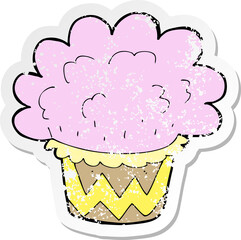 retro distressed sticker of a cartoon cupcake