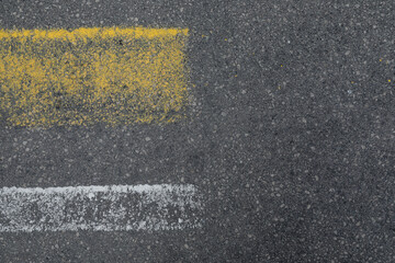 Fototapeta premium Grey asphalt road with white and yellow lines, space for text, no person