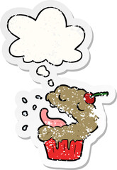 cartoon cupcake with thought bubble as a distressed worn sticker