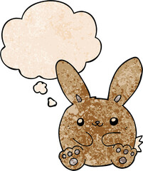 cartoon rabbit with thought bubble in grunge texture style