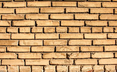 Obraz premium Old brick wall background, brick wall texture, structure. old broken brick, cement joints, close-up. Construction, repair. Concept of devastation, decline.