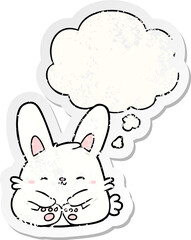 cartoon rabbit with thought bubble as a distressed worn sticker