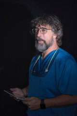 bearded mature doctor dressed in blue suit