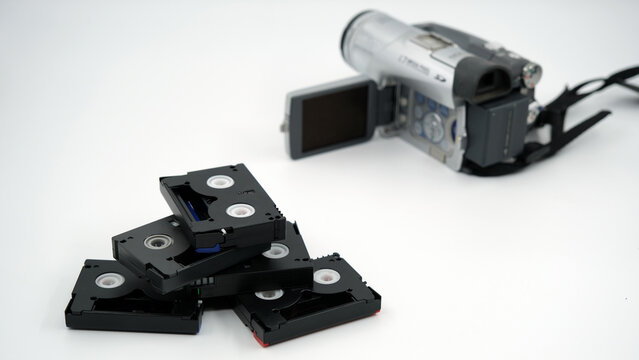 mini dv camera and cassettes, minidv tapes on the white background