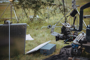 Professional cinema and video camera on the set. Shooting shift, lighting fixtures, shooting equipment and the team.