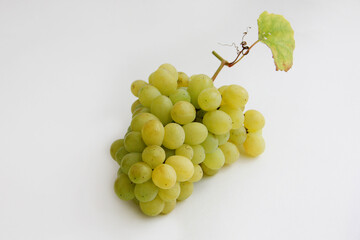 bunch of grapes. a bunch of green grapes on a white background