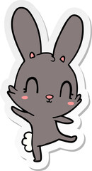 sticker of a cute cartoon rabbit dancing