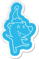 laughing bear quirky cartoon  sticker of a wearing santa hat