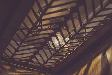 One night lamppost shines with faint mysterious yellow light through evening fog. Streetlight shine...