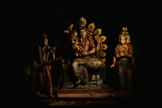 Closeup Of Indian God Statues With A Black Background