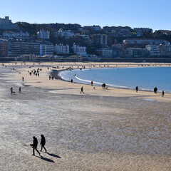 San Sebastian, Spain - 22 Jan, 2022: Winter along La Concha Bay & the beachfront promenade