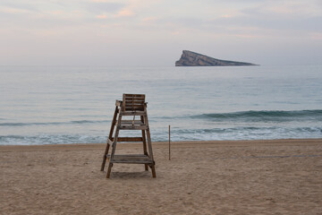 Early morning views of Benidorm Rock (Peacock Island) from Benidorm beach.  Benidorm, Spain