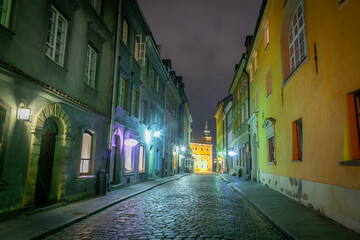 Fototapeta na wymiar Warsaw's Old Town illuminated street at night, Poland, Eastern europe