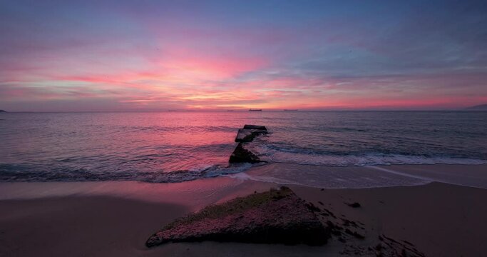 Dramatic sea sunrise over lonely island beach