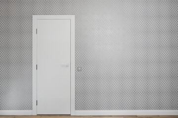 White interior door in an empty room
