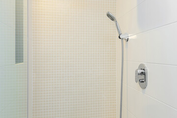 Shower system in the white shower room interior