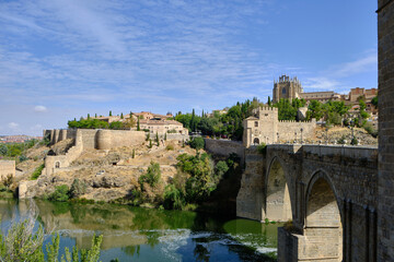 Fototapeta premium San Martin's Bridge in Toledo, Spain, a scenic 14th-century pedestrian bridge offering sweeping views of the Tagus River.