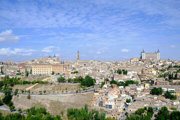 Fototapeta na wymiar View of Toledo, Spain. It is a World Heritage Site by UNESCO. Famous landmarks such as the Primatial Cathedral of Saint Mary of Toledo, Alcázar of Toledo, and the Tagus River are seen.