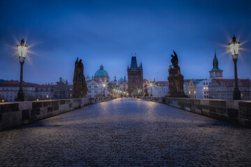 Charles bridge illuminated at dawn, Medieval Prague, Czech Republic