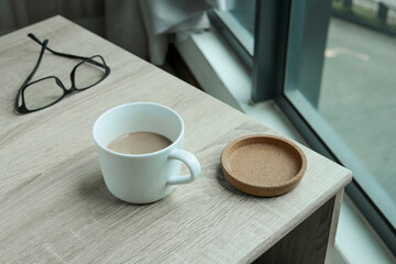 A half-full cup of coffee on the table