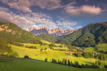 St. Magdalena with famous church in Val di Funes at sunset, Dolomites , Italy