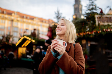 blonde with mulled wine at the Christmas market in Dresden, Germany